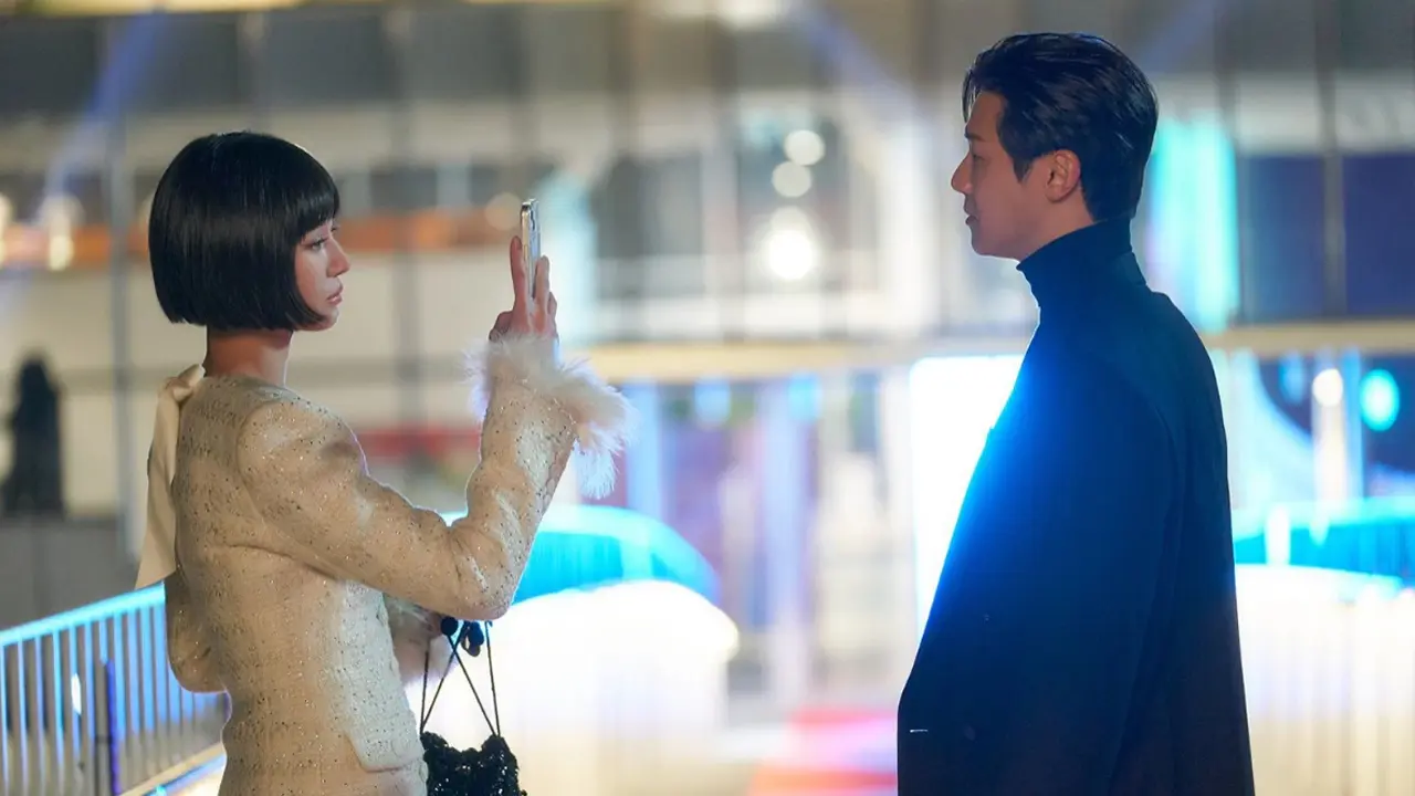 two characters from the kdrama celebrity standing on a bridge